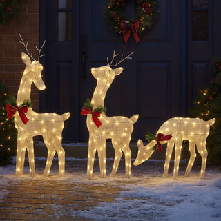 Light-up reindeer Christmas decorations glowing outside a festive home, Neo Direct Christmas Shop